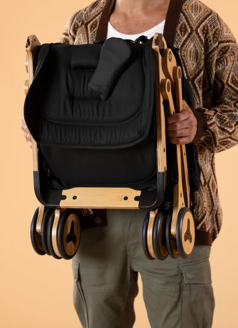 The Panda travel stroller folded, standing upright