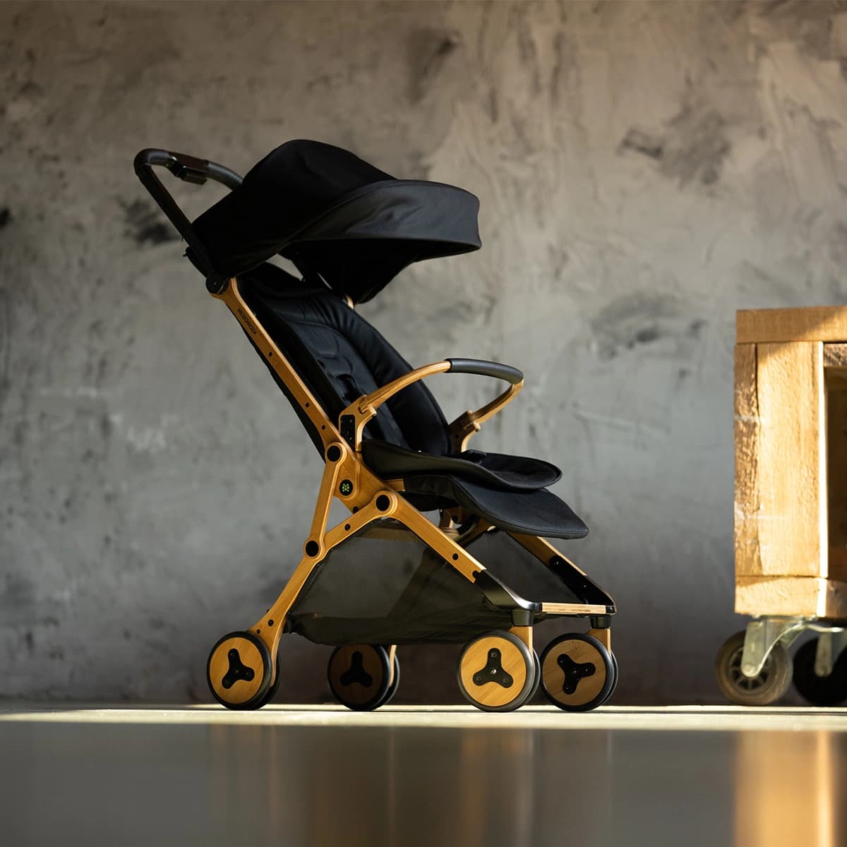 Panda travel stroller carried by its hidden handle
